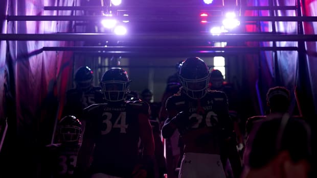 The Cincinnati Bearcats walk down to the field prior to the first quarter during a college football game against the Navy Midshipmen, Saturday, Nov. 5, 2022, at Nippert Stadium in Cincinnati. Ncaaf Navy Midshipmen At Cincinnati Bearcats Nov 6 0312