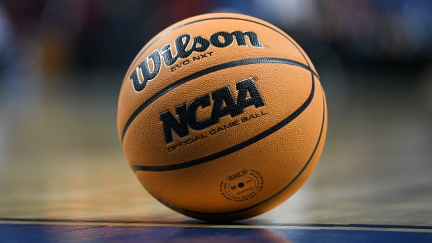 A general shot of an NCAA game ball resting on the court.