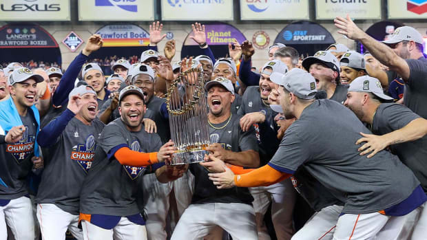 Nov 5, 2022; Houston, Texas, USA; Houston Astros holds the World Series trophy after the Astros defeated the Philadelphia Phillies in game six winning the 2022 World Series at Minute Maid Park.