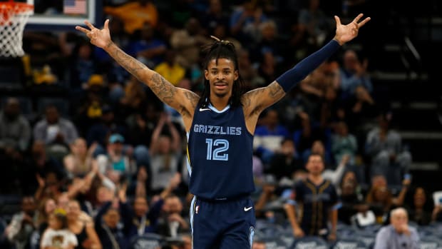 Nov 4, 2022; Memphis, Tennessee, USA; Memphis Grizzlies guard Ja Morant (12) reacts during the second half against the Charlotte Hornets at FedExForum.