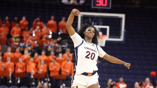 Camryn Taylor celebrates after making a shot during the Virginia women's basketball team's win over George Washington at John Paul Jones Arena.