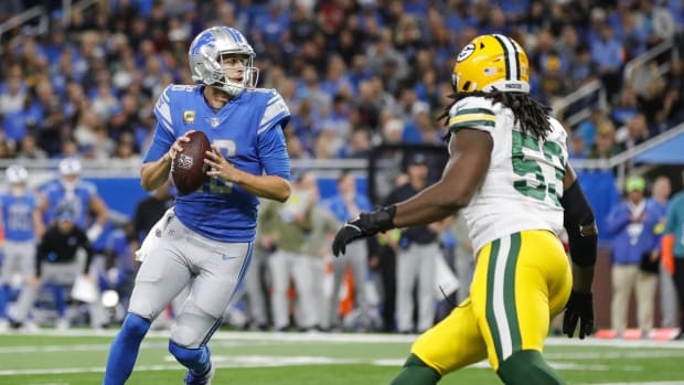 Nov 6, 2022; Detroit, Michigan, USA; Detroit Lions quarterback Jared Goff (16) looks to pass against Green Bay Packers linebacker Jonathan Garvin (53) during the second half at Ford Field. Mandatory Credit: Junfu Han-USA TODAY Sports