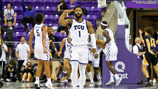 TCU Horned Frogs guard Mike Miles Jr. (1) celebrates making a three point shot against the Arkansas-Pine Bluff Golden Lions to give the Frogs the lead during the second