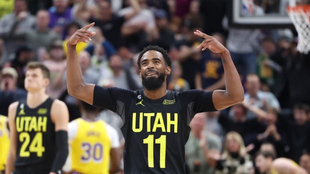 Utah Jazz guard Mike Conley (11) reacts to a play against the Los Angeles Lakers in the third quarter at Vivint Arena.