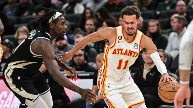 Atlanta Hawks guard Trae Young (11) drives for the basket against Milwaukee Bucks guard Jrue Holiday (21) in the third quarter at Fiserv Forum.