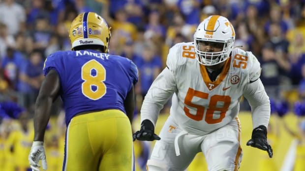 Sep 10, 2022; Pittsburgh, Pennsylvania, USA; Tennessee Volunteers offensive lineman Darnell Wright (58) blocks at the line of scrimmage against Pittsburgh Panthers defensive lineman Calijah Kancey (8) in overtime at Acrisure Stadium. Mandatory Credit: Charles LeClaire-USA TODAY Sports