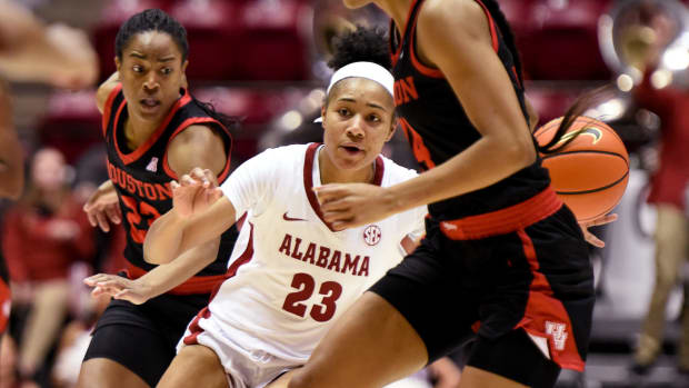 Alabama guard Brittany Davis (23) brings the ball up under heavy pressure against Houston in the third round of the WNIT played at Coleman Coliseum Thursday, March 24, 2022.