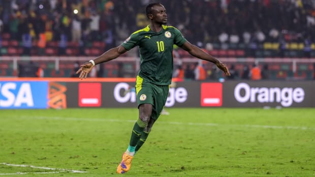 Sadio Mane of Senegal celebrates after scoring winning penalty during the Africa Cup of Nations Final.