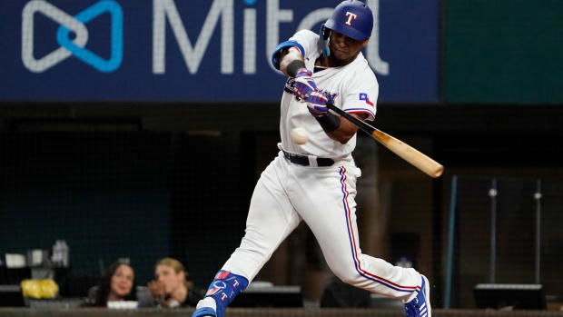 Texas Rangers catcher Meibrys Viloria hits a double against the Orioles. (2022)