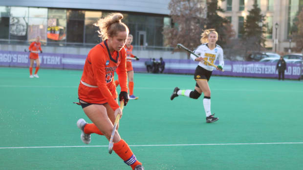 Laura Janssen moves the ball ahead during the Virginia field hockey game against Iowa in the NCAA Field Hockey Championships in Evanston, Illinois.