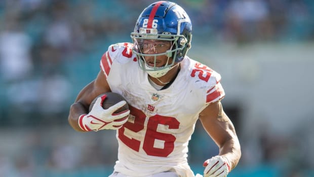 Giants running back Saquon Barkley runs with the ball during a game vs. the Jaguars.