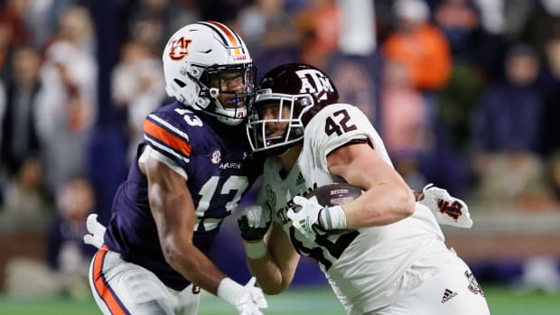 Nov 12, 2022; Auburn, Alabama, USA; Texas A&M Aggies tight end Max Wright (42) is tackled by Auburn Tigers linebacker Cam Riley (13) during the second quarter at Jordan-Hare stadium. Mandatory Credit: John Reed-USA TODAY Sports