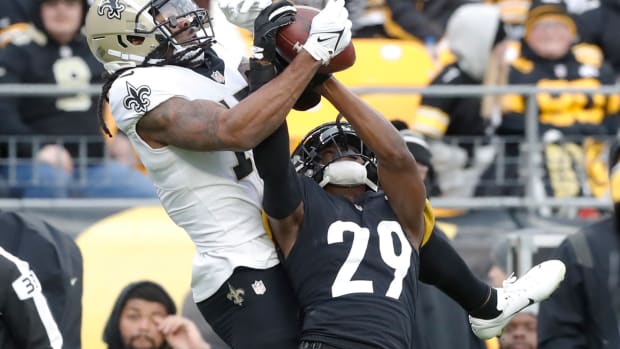 Nov 13, 2022; Pittsburgh, Pennsylvania, USA; Pittsburgh Steelers cornerback Levi Wallace (29) intercepts a pass intended for New Orleans Saints wide receiver Kevin White (17) during the fourth quarter against at Acrisure Stadium. The Steelers won 20-10. Mandatory Credit: Charles LeClaire-USA TODAY Sports