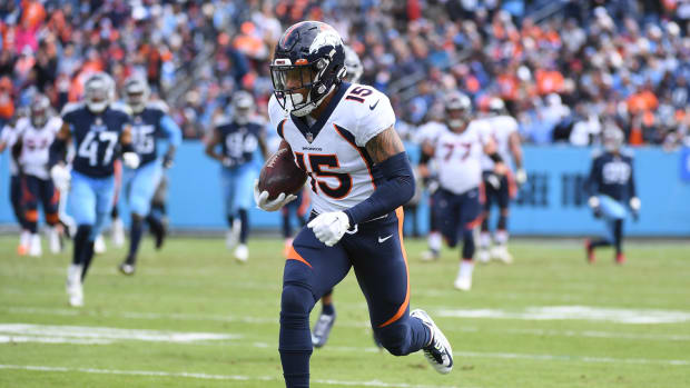 Denver Broncos wide receiver Jalen Virgil (15) runs for a touchdown after a reception during the first half against the Tennessee Titans at Nissan Stadium.
