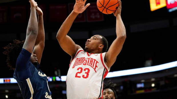 Nov 10, 2022; Columbus, OH, USA; Ohio State Buckeyes guard Zed Key (23) shoots over Charleston Southern Buccaneers forward Taje' Kelly (14) during the first half of the NCAA men's basketball game at Value City Arena. Mandatory Credit: Adam Cairns-The Columbus Dispatch

Charleston Southern At Ohio State Men S Basketball