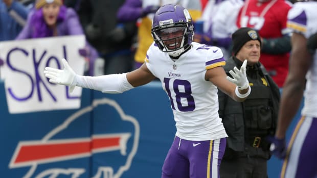 Justin Jefferson gestures after scoring a touchdown early in the Vikings' victory over the Bills