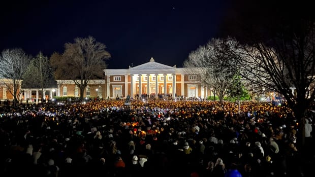 Students and other members of the University of Virginia community gather for a vigil in front of Old Cabell Hall on the Lawn on Monday night in Charlottesville, Virginia following the fatal shootings of three UVA football players.