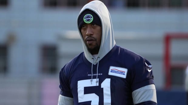 Seahawks linebacker Bruce Irvin looks on while wearing a sweatshirt during practice before playing a game in Germany.