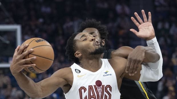 November 11, 2022; San Francisco, California, USA; Cleveland Cavaliers guard Donovan Mitchell (45) is fouled by Golden State Warriors forward Andrew Wiggins (22) during the second quarter at Chase Center. Mandatory Credit: Kyle Terada-USA TODAY Sports