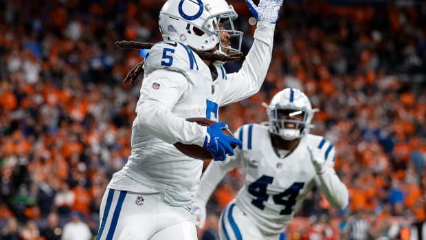 Indianapolis Colts cornerback Stephon Gilmore (5) reacts after an interception in the fourth quarter against the Denver Broncos at Empower Field at Mile High.