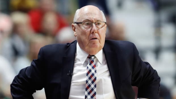 Washington Mystics coach Mike Thibault stands on the sidelines during a game.