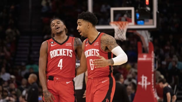 Nov 14, 2022; Houston, Texas, USA; Houston Rockets guard Jalen Green (4) and forward Kenyon Martin Jr. (6) communicate during a LA Clippers timeout in the third quarter at Toyota Center. Mandatory Credit: Thomas Shea-USA TODAY Sports