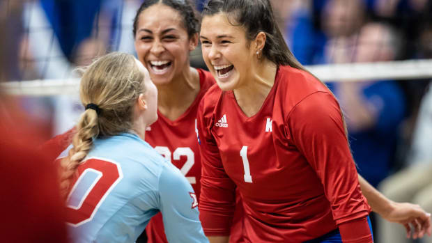 Kansas Jayhawk players celebrate after scoring a point against the Kansas State Wildcats at Horejsi Family Volleyball Arena on September 24, 2022.