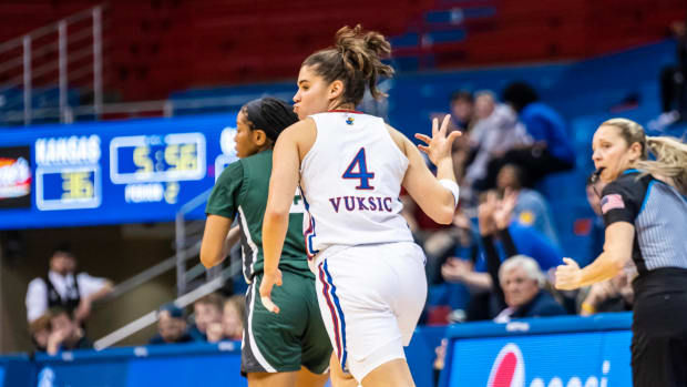 Kansas junior guard Mia Vuksic celebrates after hitting a three-pointer against the Jacksonville Dolphins in Allen Fieldhouse on November 9th, 2022. The Jayhawks won the game 72-61.