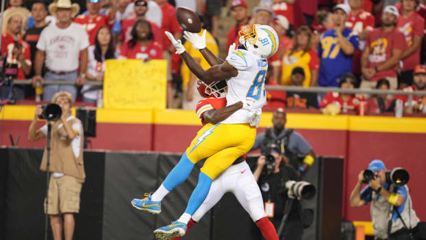 Sep 15, 2022; Kansas City, Missouri, USA; /Los Angeles Chargers wide receiver Mike Williams (81) catches a pass against Kansas City Chiefs cornerback Rashad Fenton (27) during the first half at GEHA Field at Arrowhead Stadium. Mandatory Credit: Jay Biggerstaff-USA TODAY Sports