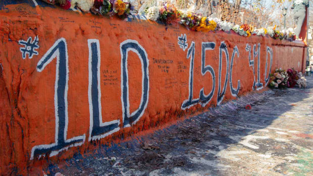 Painted and written messages on Beta Bridge at the University of Virginia to honor Lavel Davis Jr., Devin Chandler, and D'Sean Perry.