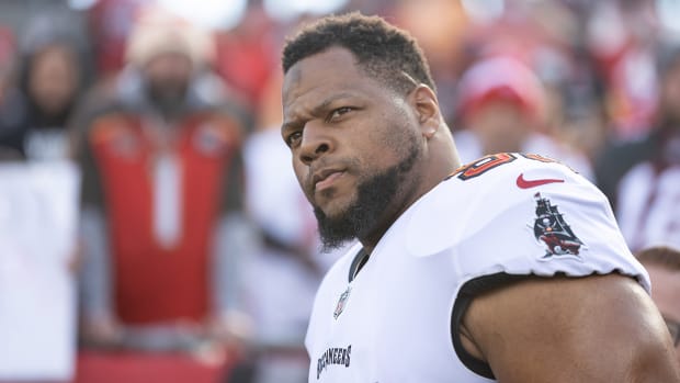 Tampa Bay Buccaneers defensive end Ndamukong Suh (93) walks onto the field before the game against the Los Angeles Rams during a NFC Divisional playoff football game at Raymond James Stadium.