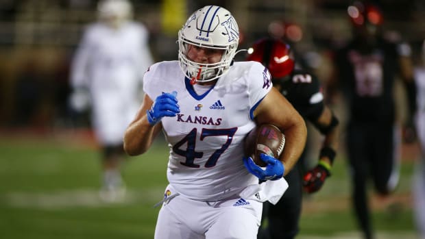 Nov 12, 2022; Lubbock, Texas, USA; Kansas Jayhawks tight end Jared Casey (47) rushes for a touchdown against the Texas Tech Red Raiders in the first half at Jones AT&T Stadium and Cody Campbell Field. Mandatory Credit: Michael C. Johnson-USA TODAY Sports