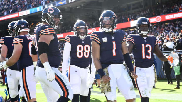 Nov 13, 2022; Chicago, Illinois, USA; Chicago Bears quarterback Justin Fields (1) celebrates with Chicago Bears tight end Trevon Wesco (88) and Chicago Bears wide receiver Byron Pringle (13) after he scores a touchdown against the Detroit Lions during the first half at Soldier Field.