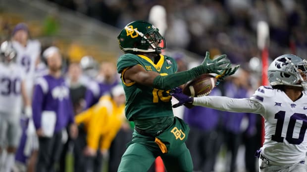 Nov 12, 2022; Waco, Texas, USA; Kansas State Wildcats cornerback Jacob Parrish (10) breaks up a pass intended for Baylor Bears wide receiver Hal Presley (16) during the second half at McLane Stadium. Mandatory Credit: Chris Jones-USA TODAY Sports