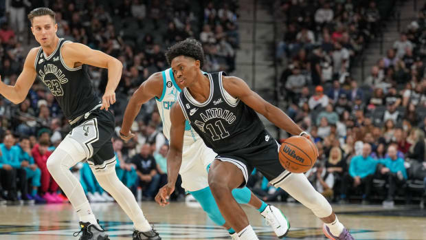 San Antonio Spurs guard Joshua Primo (11) dribbles the ball in the first half against the Charlotte Hornets at the AT&T Center.