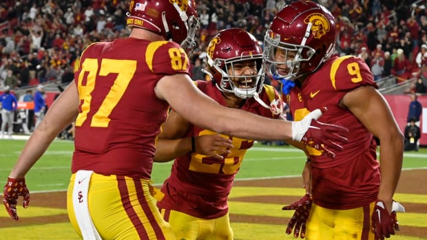 Southern California tight end Lake McRee, from left, defensive back Briton Allen (25) and wide receiver Michael Jackson III celebrate a touchdown against California during the first half of an NCAA college football game Saturday, Nov. 5, 2022, in Los Angeles. (AP Photo/John McCoy)
