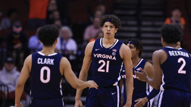 Virginia Cavaliers forward Kadin Shedrick (21) reacts after being fouled in front of guard Kihei Clark (0) and guard Reece Beekman (2) during the second half against the Georgia Bulldogs at Prudential Center.