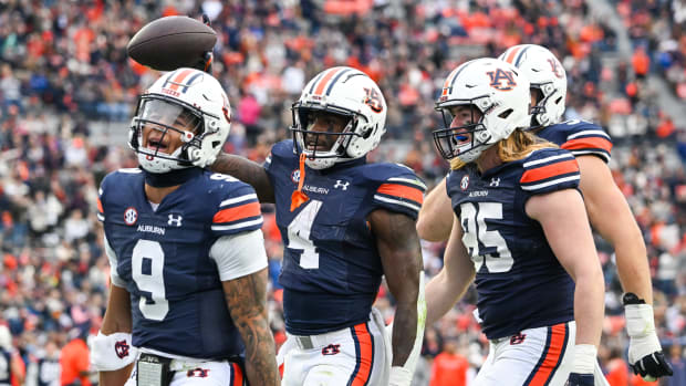 Tyler Fromm (85),Robby Ashford (9),and Tank Bigsby (4) celebrate a touchdownduring the football game between the Western Kentucky Hilltoppers and the Auburn Tigers at Jordan Hare Stadium in Auburn, AL on Saturday, Nov 19, 2022. Todd Van Emst/Auburn Tigers