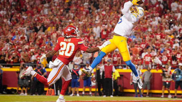 Sep 15, 2022; Kansas City, Missouri, USA; Los Angeles Chargers wide receiver Joshua Palmer (5) catches a touchdown pass against Kansas City Chiefs safety Justin Reid (20) during the second half at GEHA Field at Arrowhead Stadium. Mandatory Credit: Jay Biggerstaff-USA TODAY Sports