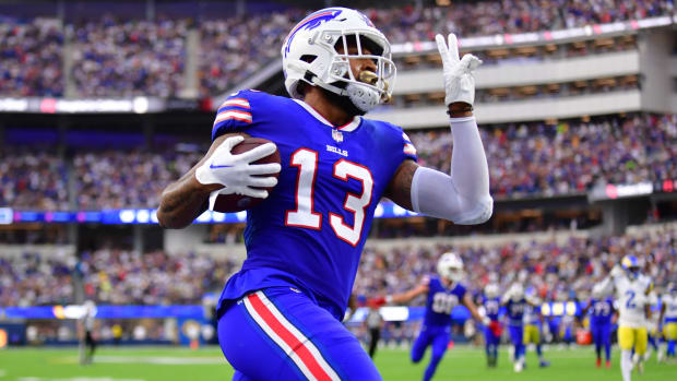 Bills wide receiver Gabe Davis (13) runs the ball in for a touchdown in the first quarter of a game against the Rams.