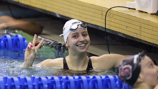 Virginia swimmer Kate Douglass celebrates after winning a race at the 2022 NCAA Swimming & Diving National Championships.