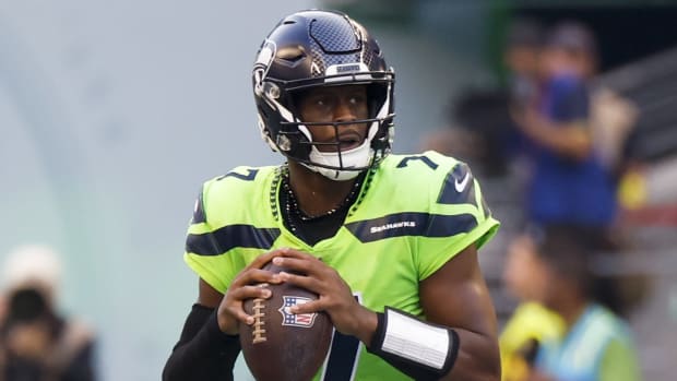 Seattle Seahawks quarterback Geno Smith (7) looks to pass against the Denver Broncos during the second quarter at Lumen Field.
