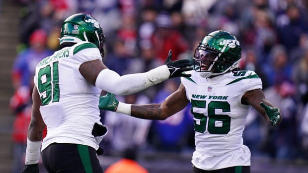 New York Jets defenders John Franklin-Myers and Quincy Williams celebrate sack