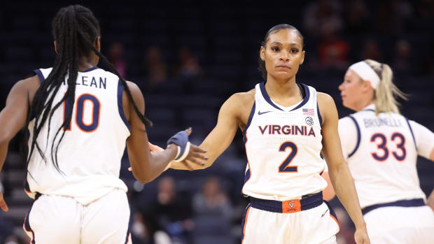 Taylor Valladay slaps the hand of teammate Mir McLean during the Virginia women's basketball game against Wake Forest at John Paul Jones Arena.