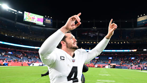 Raiders quarterback Derek Carr celebrates after his team's overtime win against the Broncos in Week 11.