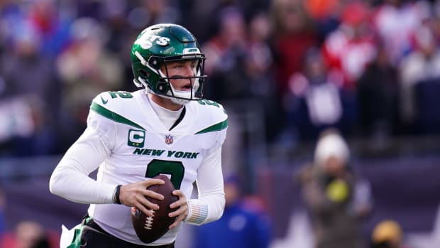 New York Jets QB Zach Wilson looks to pass against New England Patriots