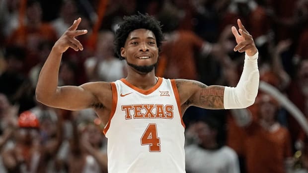 Texas's Tyrese Hunter gestures after a three