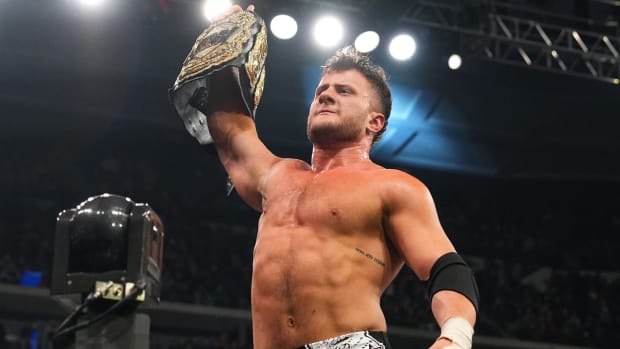MJF poses with the AEW world championship after defeating Jon Moxley