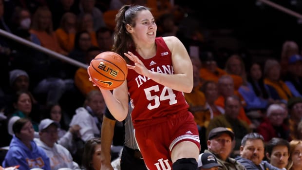 Indiana forward Mackenzie Holmes saves the ball from going out of bounds against Tennessee.