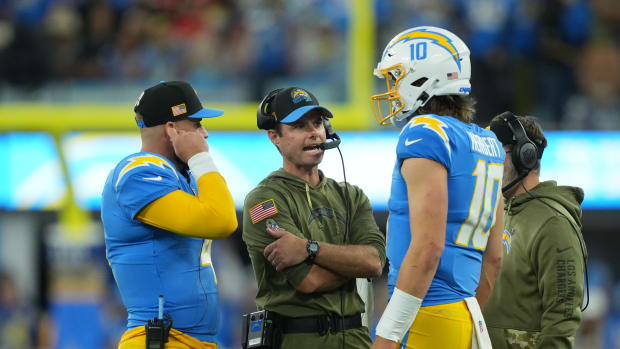 Nov 20, 2022; Inglewood, California, USA; Los Angeles Chargers head coach Brandon Staley (center) talks with quarterback Justin Herbert (10) and quarterback Chase Daniel (4) in the first half against the Kansas City Chiefs at SoFi Stadium. Mandatory Credit: Kirby Lee-USA TODAY Sports
